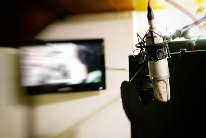 Recording with studio microphone at Sound Guru Studios